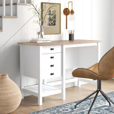 a chair and table in a room with stairs