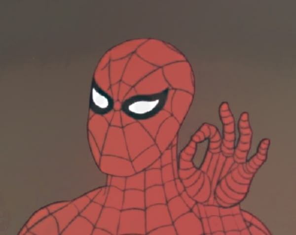 a spider - man with his hands in the air and eyes wide open, staring at something