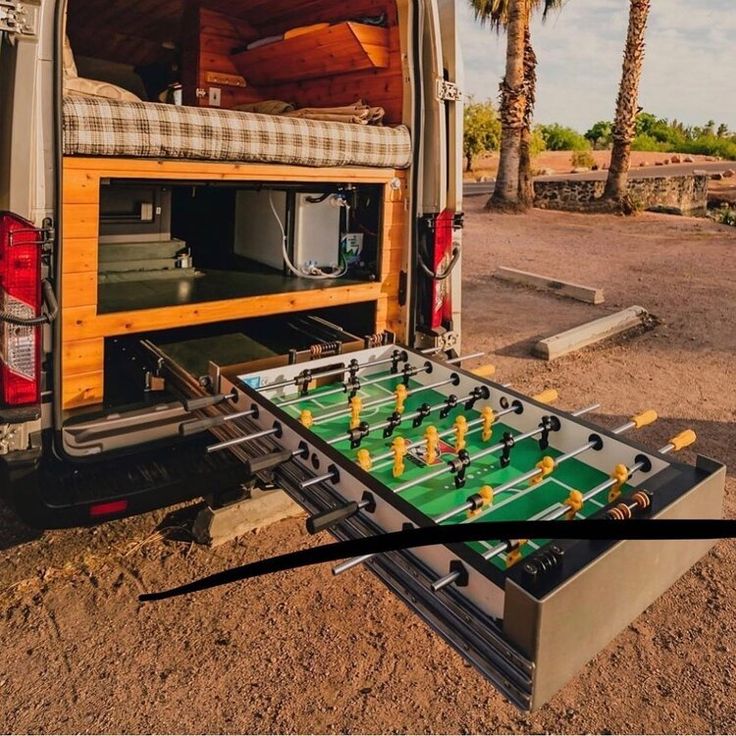 an open van with foosball in the back