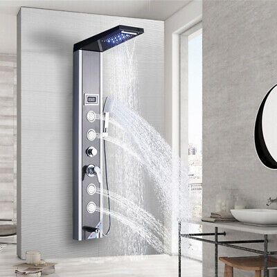 a modern shower head in the middle of a bathroom