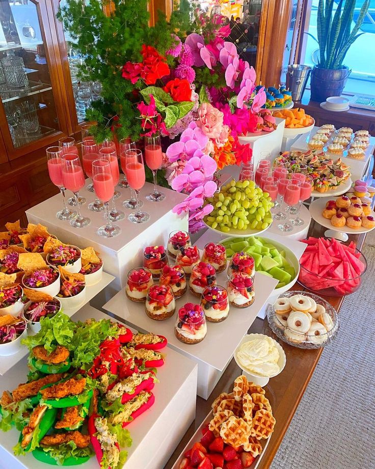 an assortment of desserts and pastries on display at a wedding or bridal party