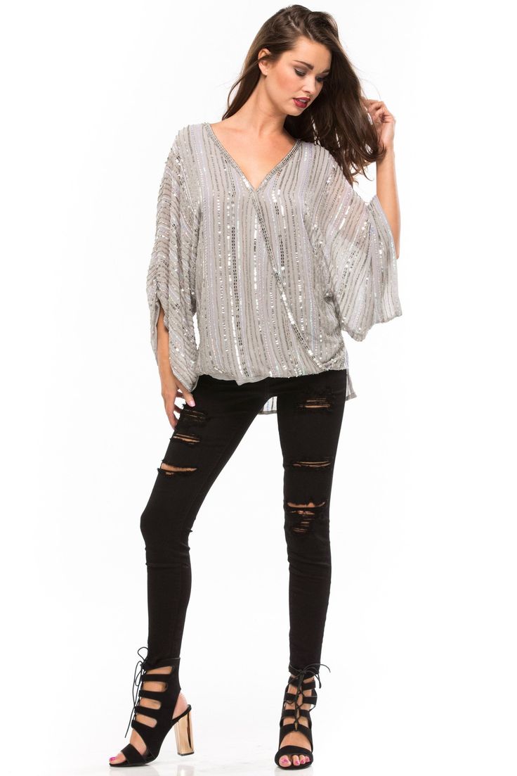 Parker "Bayside" top is made of beading and iridescent sequins throughout. Features include a twist wrap front and v-neckline. Oversized with a relaxed silhouette. Partially lined. Polyester Beautiful Blouses, Swim Accessories, Top Sales, Denim Outfit, New Shop, Bling Bling, Dresses For Sale, Black Jeans, Beading