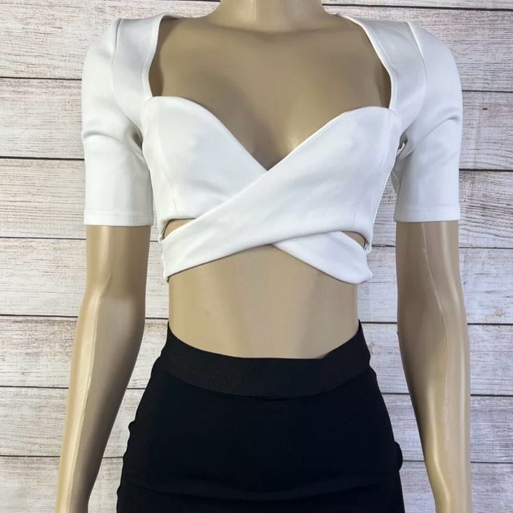 Elevate Your Wardrobe With This Stunning Ivory Crop Top From Tobi. Perfect For Any Occasion, It Features A Sweetheart Neckline, Short Sleeves, And A Casual Sleeve Style. The Pullover Closure Ensures A Comfortable Fit, While The Breathable Polyester Material Makes It Perfect For All Seasons. Accessorized With A Strap Accent And A Solid Pattern, This Limited Edition Crop Top Is A Regular Fit And Is Available In Size Xs. Hand Wash Only, This Bohemian Style Top Is Ideal For Both Party/Cocktail And C Chic White V-neck Crop Top, White Stretch Tops For Night Out, White Crop Top For Night Out, Chic White Crop Top For Night Out, White Fitted Chic Crop Top, White Fitted Crop Top For Party, White Short Sleeve Crop Top For Day Out, White Cropped Chic Top, White V-neck Top For Night Out