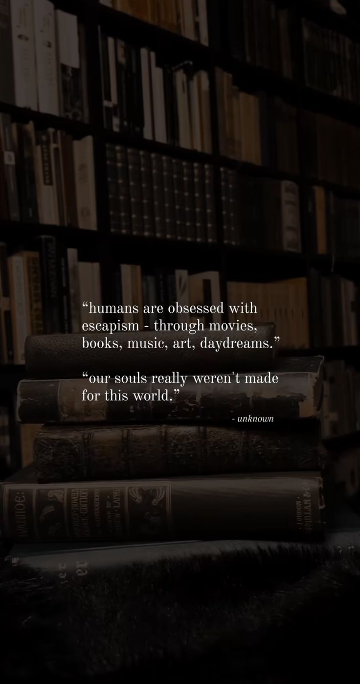 a stack of books sitting on top of a table next to a book shelf filled with books