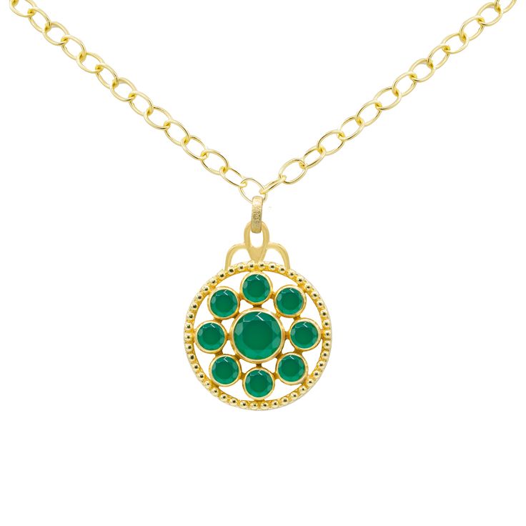 This 18k gold plated medallion necklace features a stunning gemstone design, adding a touch of sophistication and elegance. The necklace measures 17 to 18 inches, allowing for a versatile fit. Available in Tanzanite, Green Onyx, Blue Sapphire, and Peach Moonstone, each option brings its own unique hue and character. Pair this necklace with the Florentina Earrings, Giselle Stud Earrings, and Arden Ring for a coordinated and polished look. Gold Medallion Necklace With Jewels, Elegant Green Jewelry With Coin Pendant, Yellow Gold Necklace With Jeweled Round Pendant, Yellow Gold Jeweled Round Pendant Necklace, Yellow Gold Necklace With Jewels In Round Pendant, Yellow Gold Round Pendant Necklace With Jewels, Luxury Emerald Necklace With Round Pendant, Elegant Medallion Necklace For May Birthstone, Medallion Necklace