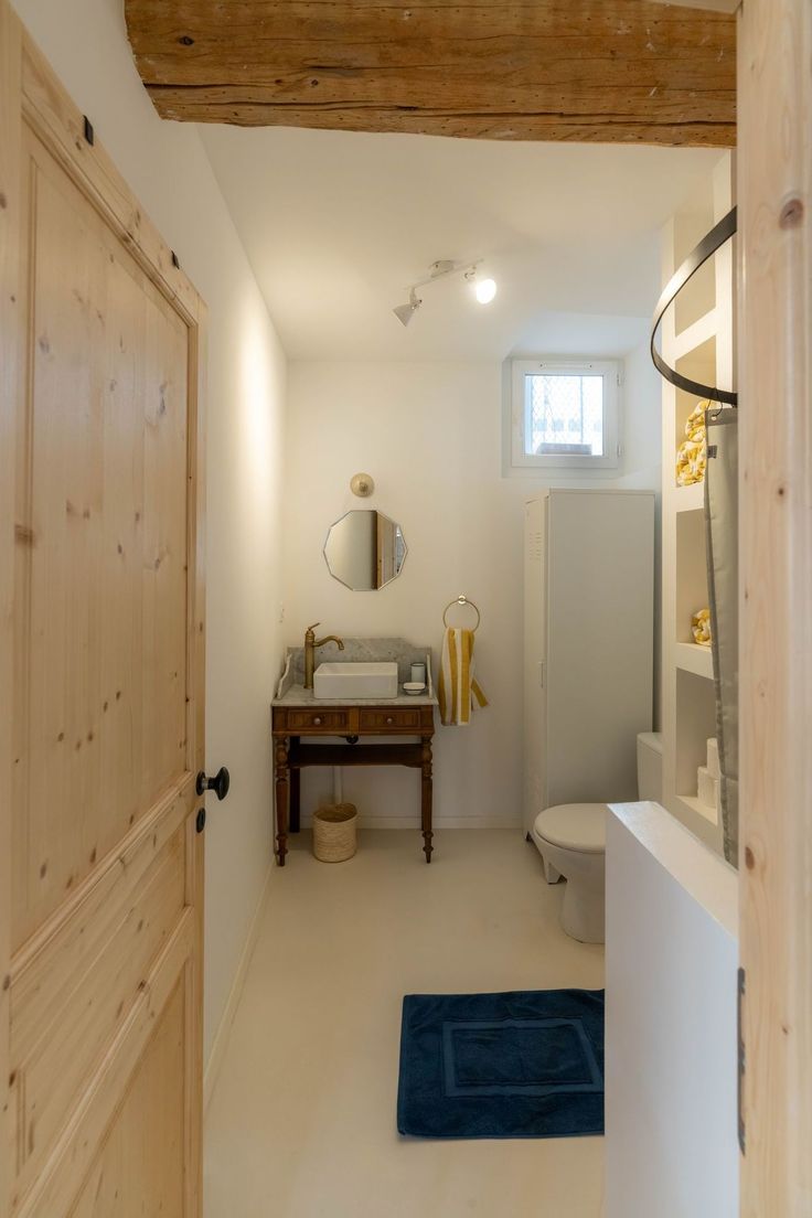 the bathroom is clean and ready to be used as a home office or guest room