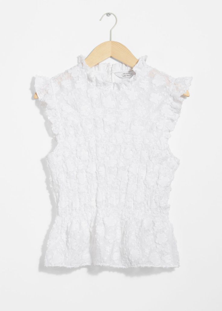 Sleeveless top defined by a smocked finish. Designed with a peplum hemline and frilled detailing at the arm openings and neckline.• Slim fit• Buttoned keyhole closure• Length of top:52.5cm / 20.7" (EU 36 / UK 8 / US 4) Sleeveless Smocked Top With Ruffles For Spring, Chic Sleeveless Smocked Top With Ruffle Hem, White Smocked Top With Ruffle Hem, Chic White Smocked Top With Ruffle Hem, Fitted Ruffle Sleeve Peplum Top For Summer, Spring Smocked Peplum Top With Ruffles, Fitted Sleeveless Smocked Top With Ruffles, Spring Sleeveless Top With Smocked Bodice, Sleeveless Ruffled Smocked Top