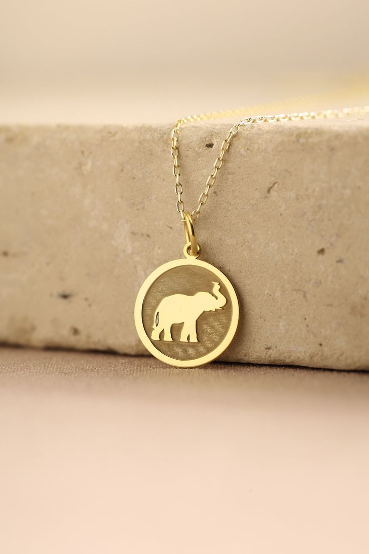 Gold Elephant Pendant - Elephant Gold Necklace ● Material of pendant: Solid Gold 14k ( REAL GOLD ) ● Metal Stamp: 14k ( REAL GOLD ) ● The pendant is available in 5 sizes: - 12,7 mm / 0.5 inches (Diameter) - 14,0 mm / 0,55 inches ( Diameter ) In the photos - 15,3 mm / 0.6 inches ( Diameter ) - 16,5 mm / 0,65 inches ( Diameter ) - 19,1 mm / 0,75 inches ( Diameter ) ( In the photos the size is 14mm / 0.55 inches Diameter ) ( Jump Ring inner diameter: 4 mm ) ● Material of chain: Solid gold 14k ( REA Round Charms Necklace For Birthday Gift, Silver Charm Necklace Stamped 14k As Gift, Gift Silver Charm Necklace Stamped 14k, Yellow Gold Necklaces With Charms For Birthday Gift, Yellow Gold Jewelry With Charms For Birthday Gift, Yellow Gold Jewelry With Hallmark For Birthday, Round Hallmark Charm Necklaces For Gifts, Handmade Round Charm Necklaces For Birthday, Round Charm Necklaces With Hallmark For Gift