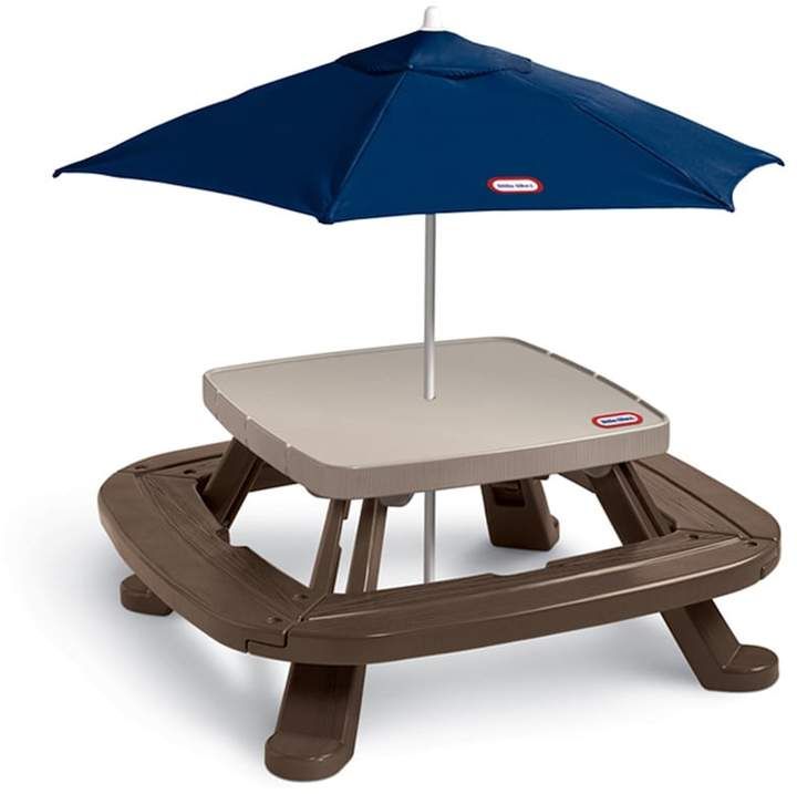 a small child's picnic table with an umbrella on top, and a stool underneath it