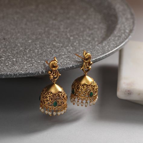 These antique earrings feature a simple jhumki design. Antique gold-tone plated earrings, crafted with peacock motif stud, are attached to the jhumki-shaped filigree design . Ideal for simple occasions and for young girls. Details & Specifications: Materials used: Brass Alloy with Antique Plating Weight - Earrings 16 gm Length - Earrings 4 cm Make it custom Want to make it a custom earring? Sure! Reach out to us at support@tarinika.com and we’ll be happy to make possible modifications at no extr Gold Plated Filigree Earrings For Diwali, Filigree Earrings For Diwali Gift, Filigree Earrings As Diwali Gift, Filigree Earrings As Gift For Diwali, Filigree Earrings Gift For Diwali, Ornate Earrings With Intricate Design For Diwali, Bollywood Filigree Earrings For Wedding, Gold Chandbali Jhumkas With Peacock Design, Filigree Earrings For Diwali Festive Occasions