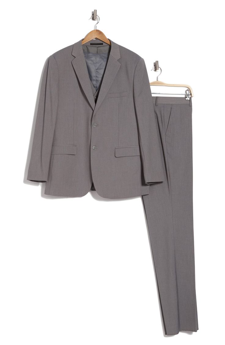 Bring understated elegance to the table in this three-piece suit crafted from rich fabric in a classic single-breasted silhouette. Jacket has notched lapels; chest welt pocket; front flap pockets Vest has front button closure; V-neck Pants have zip fly with button closure; front slant pockets; back button-welt pockets Jacket and vest are lined; trousers are lined to the knee 65% polyester, 35% viscose Dry clean Imported Suit has a 6” drop, meaning that a size 38R jacket is paired with size 32 pa Classic Office Sets Single Breasted, Classic Notched Suits With Welt Pockets, Classic Single Breasted Business Sets, Tailored Sets With Notch Lapel And Hidden Button Closure, Classic Business Sets With Collared Suit, Classic Business Sets With Suit Collar, Classic Workwear Sets With Suit Collar, Classic Notched Business Suits, Classic Workwear Sets With Welt Pockets