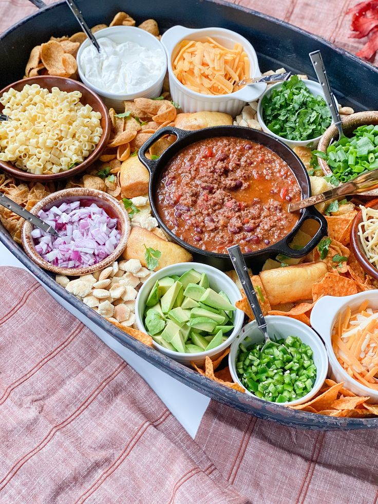 a platter filled with lots of different types of dips and condiments