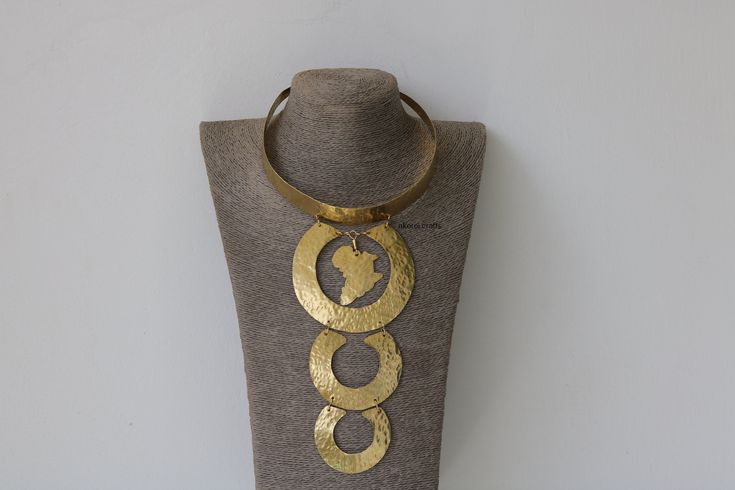 African Brass necklace, Brass jewelry, African jewelry for women, Tribal necklace, One size fits all, Christmas Gift for her, Moms gift The necklace is handcrafted using brass metal. Length: 5 inches Shipping fee is for the first item only, additional items ship for FREE. DHL Express shipping with 3-5 days delivery. To view our brass collection, click here: https://www.etsy.com/shop/NkoroiCrafts?ref=simple-shop-header-name&listing_id=1295061994&section_id=39639351 *Care instructions* Brass tarni Costume Jewelry Metal Necklaces For Gifts, Adjustable Metal Necklace As A Gift For Her, Metal Choker With Round Pendant For Gift, Metal Choker 16 Inch Length As Gift, Adjustable Choker With Unique Variations As Gift, Unique Metal Necklace As Gift, Unique Design Adjustable Necklace For Gift, Metal Choker Gift, 16 Inch Length, Bohemian Gold Necklace For Anniversary