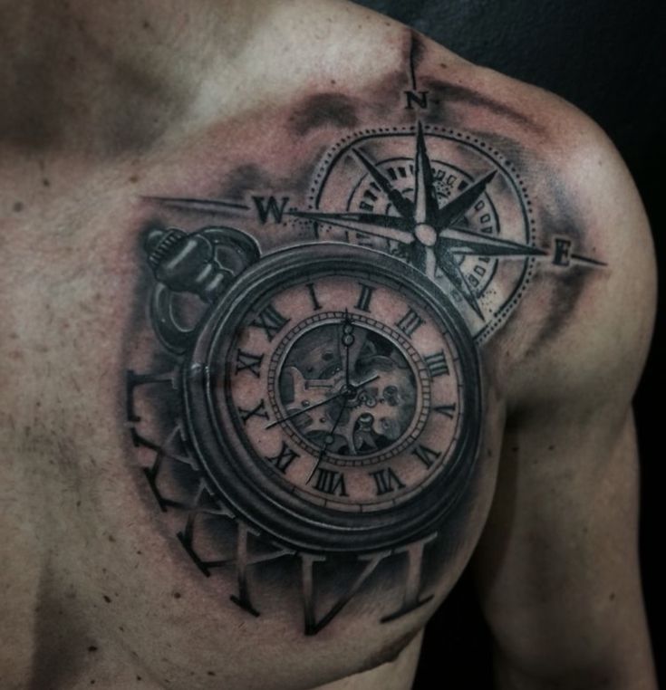 a man's chest with a clock and compass tattoo on the left side of his chest