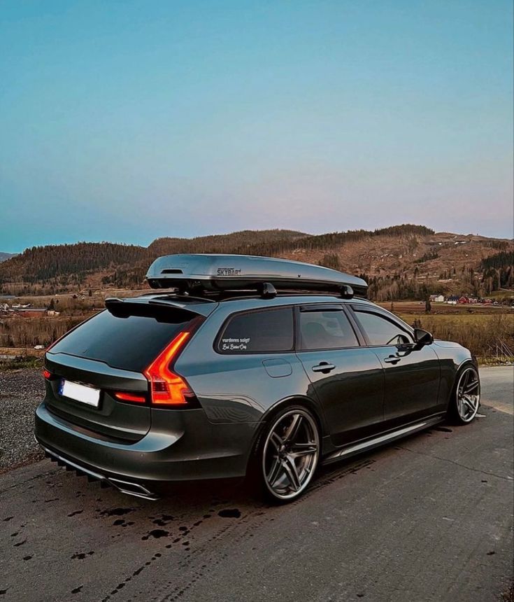 a black car parked on the side of a road