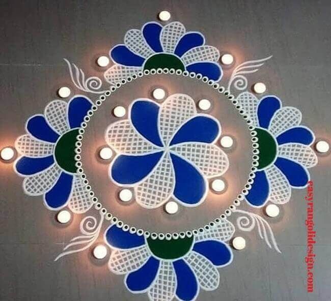 a circular design with blue, green and white flowers on the center is surrounded by small lights