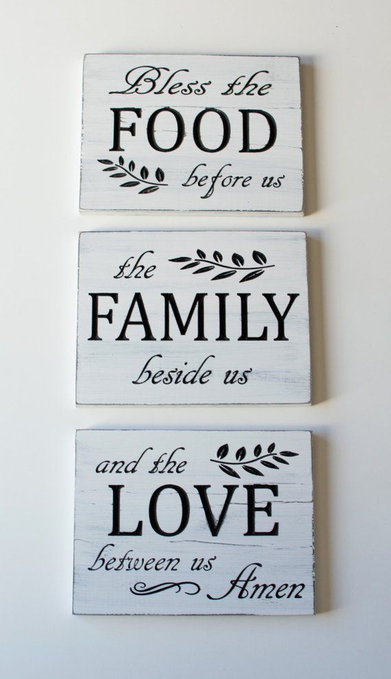 two wooden signs with words on them that say, blessing the food before us and family beside us