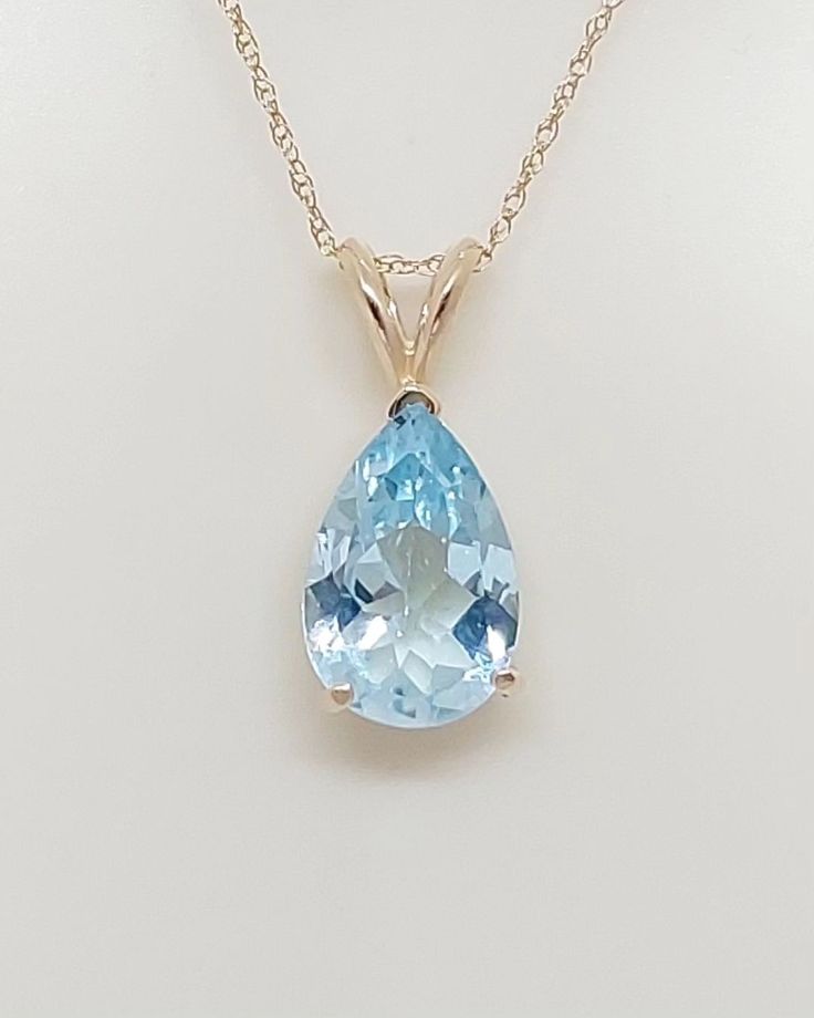 Teardrop SKY BLUE TOPAZ Necklace in 14k Yellow Gold. Natural stone Blue Topaz Pendant. 18 Inches 14k Yellow Gold Rope Chain. Gemstone Jewelry. Sky Blue Topaz December Birthday Stone. Available on Etsy.com Store name AmazingbyAlexander. Product Info: - Stone: 3.35ct Teardrop Sky Blue Topaz. https://amazingbyalexander.etsy.com/listing/1754559581 - Color: Light Blue. - Pendant Measures: 18mm x 7mm. - Stone Measures: 10x7 - Metal: 14k Yellow Gold. - Chain Length: 18 inches Rope Chain. - ... Quince Accessories, Light Blue Necklace, Birthday Stone, December Birthday, Blue Topaz Necklace, Gold Rope Chains, Blue Topaz Pendant, Topaz Pendant, Topaz Necklace