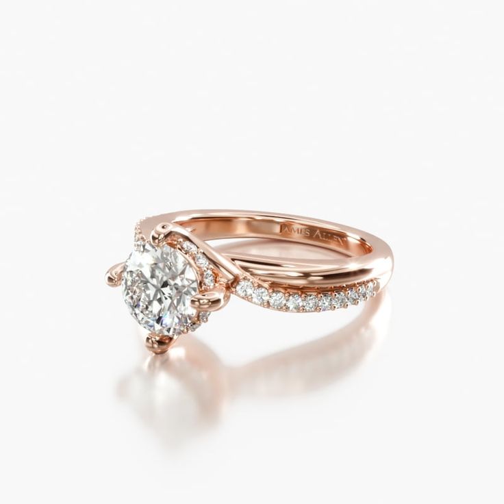 a yellow gold engagement ring set with a round diamond