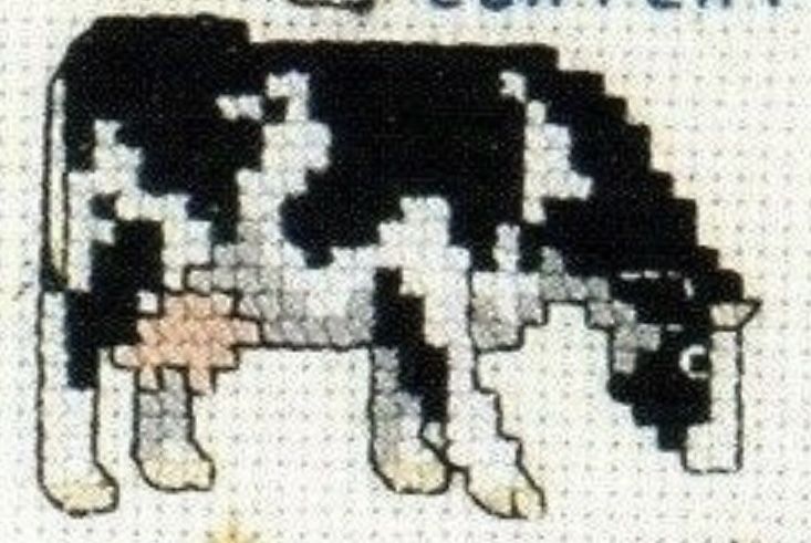 a black and white cow is depicted in this cross stitch pattern