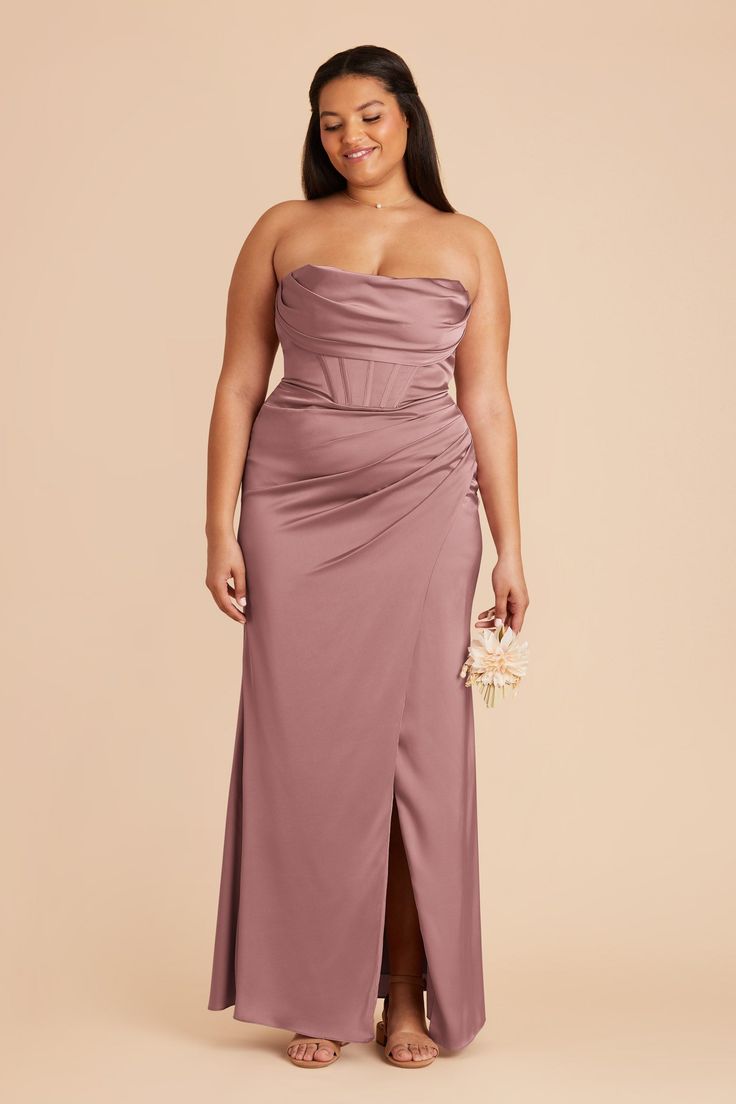 a woman in a strapless purple dress