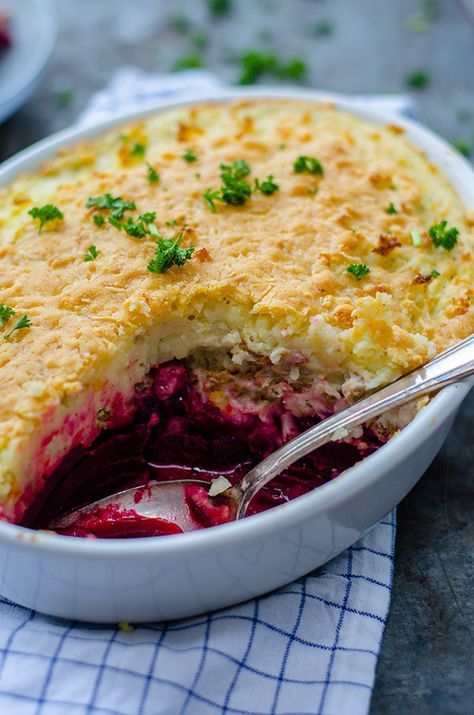 a close up of a pie in a bowl with a spoon