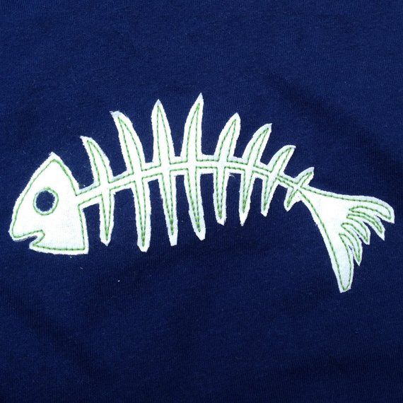 a t - shirt with a fish skeleton embroidered on the front and back, in white thread