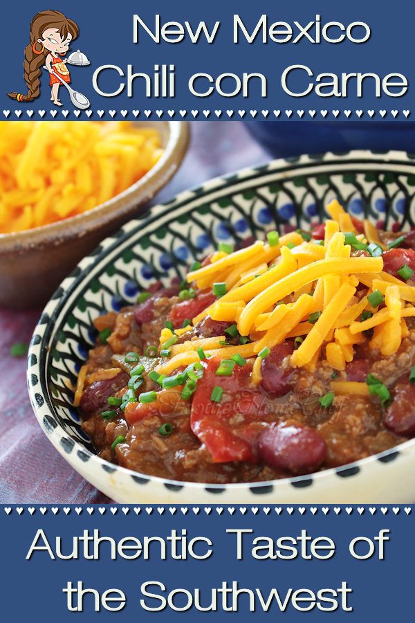 a bowl filled with chili and cheese on top of a table