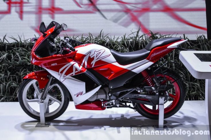 a red and white motorcycle is on display