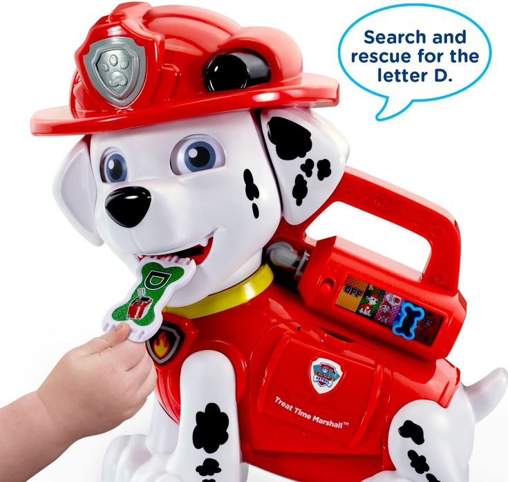 a child's hand is holding a toy fire dog with a speech bubble above it