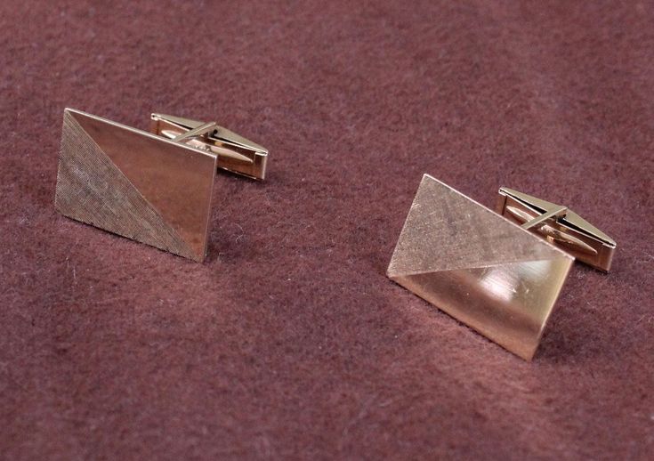 These are handsome, heavy 14K cufflinks.  They have a modernist design, with half the rectangular shape having a high shiny finish, and half with a cross-hatched  finish. Estimated age is the 1970s. Condition is good vintage. Both hinge pins work well.  Each rectangular cufflink features one-half highly polished gold and one-half textured cross hatching, as contrast. The cufflinks are each stamped 14K and VWC. DIMENSIONS  Length: 7/8 inch Width: 9/16 inch Weight: 10.5 grams  SKU 1594 Modernist Rectangular Jewelry For Formal Occasions, Modern Rectangular Jewelry For Formal Occasions, Modern Polished Cufflinks For Formal Occasions, Rectangular Polished Finish Cufflinks For Anniversary, Luxury Rectangular Cufflinks With Polished Finish, Modern Cuff Jewelry For Office, Anniversary Rectangular Polished Finish Cufflinks, Modern Cuff Jewelry For The Office, Anniversary Rectangular Cufflinks With Polished Finish