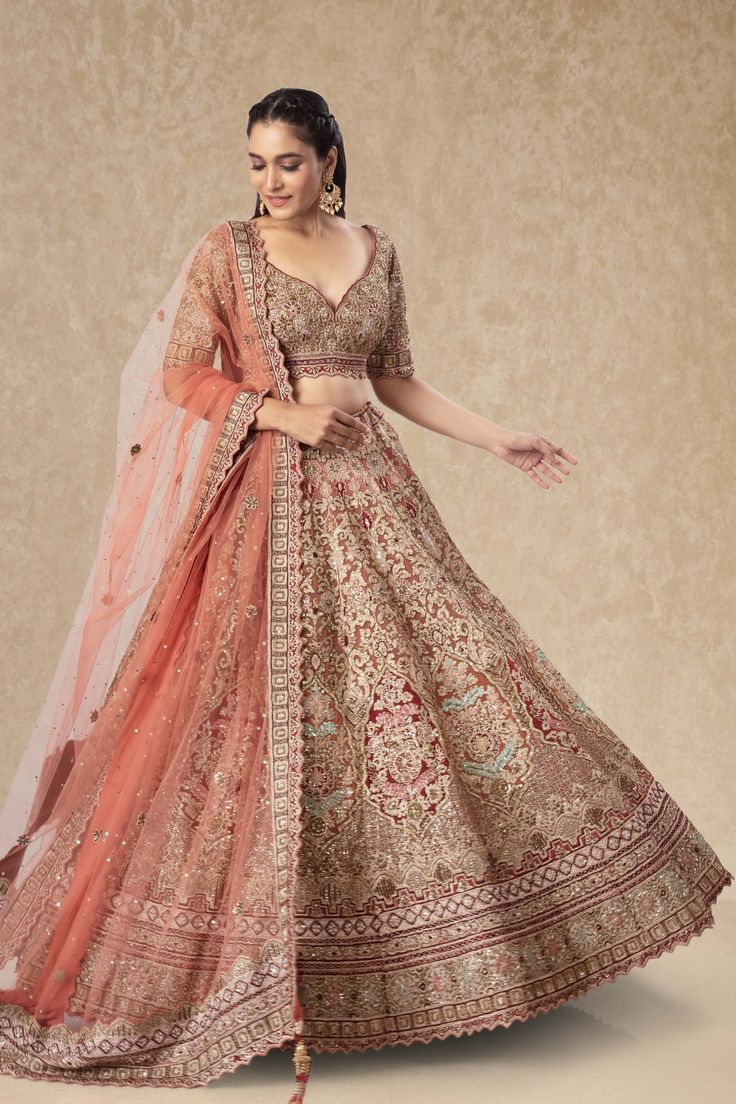 "This Bridal Lehenga BL-217 features intricate sequence and bead work, adding a touch of glamour to any bride's wedding day ensemble. With its delicate detailing and high-quality craftsmanship, this lehenga is sure to make any bride feel like a true princess on her special day. Make your wedding dreams a reality with the Bridal Lehenga BL-152." WASH CARE INSTRUCTIONS - Please Dry clean only when it is applicable! Ready to Ship! Gold Hand Embellished Lehenga For Wedding, Hand Embellished Gold Lehenga For Wedding, Anarkali Style Hand Embellished Sharara For Ceremony, Elegant Raw Silk Gown With Pallu, Anarkali Hand Embellished Wedding Dress For Ceremony, Anarkali Hand Embellished Wedding Dress, Anarkali Ceremony Sets Hand Embellished, Hand Embellished Anarkali Wedding Dress, Elegant Floor-length Raw Silk Embroidered Fabric