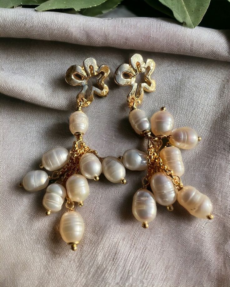 Zamak and gilded brass earrings with baroque pearls Handmade Yellow Gold Pearl Earrings, Handmade Baroque Pearl Jewelry For Parties, Handmade Gold Pearl Earrings For Party, Handmade Yellow Gold Baroque Pearl Earrings, Handmade Yellow Gold Earrings With Baroque Pearls, Gold Clip-on Pearl Earrings, Handmade Silver Baroque Pearl Earrings, Handmade Baroque Pearl Drop Earrings, Party Earrings With Pearl Charm And Baroque Pearl