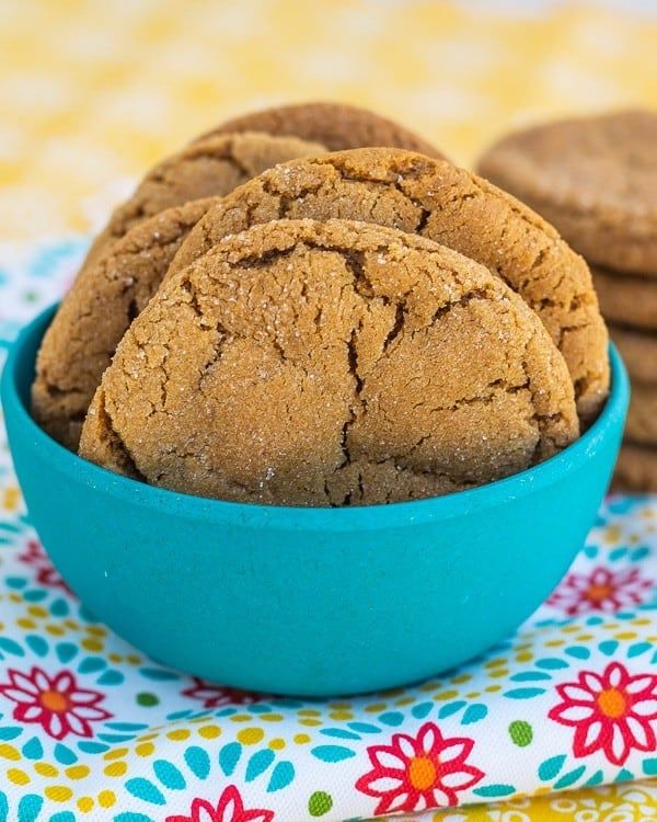 some cookies are in a blue bowl on a table