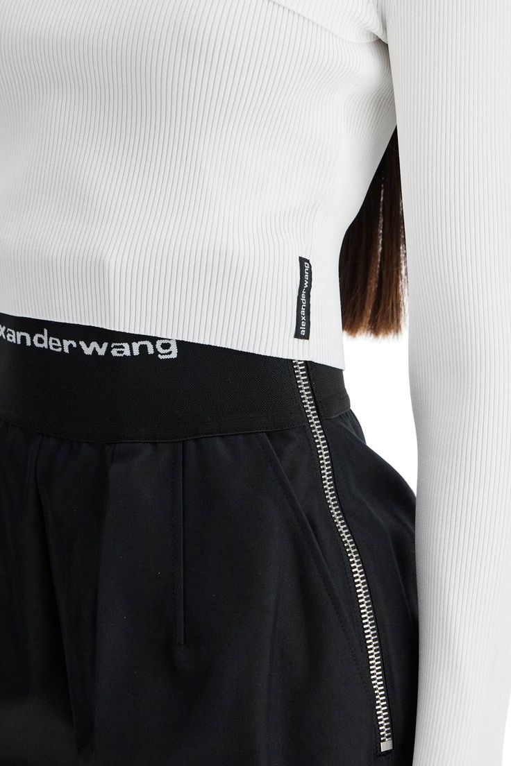 The Alexander Wang twin-set is made of ribbed stretch fabric and includes a short top and a super-cropped cardigan, both with a fitted silhouette. The top features a bandeau design with adjustable thin straps and is personalized with a logo label on the side. The cardigan has a round neckline, long sleeves, and front button closure. The model is 177 cm tall and wears size S. Composition: 59%VI, 38%PA, 3%EA Prada Leather, Twin Set, Logo Label, Fitted Silhouette, Knitwear Cardigan, Cropped Cardigan, Street Chic, A Logo, Alexander Wang