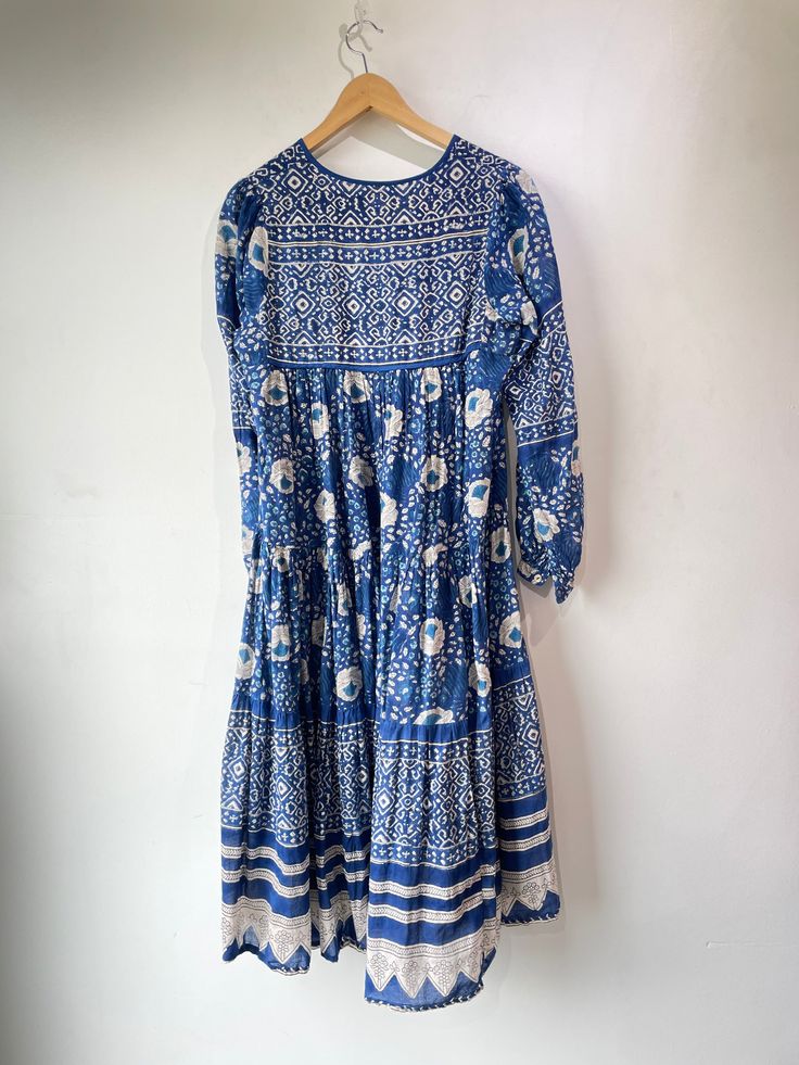 Matta Blue Block Print Dress. Amazing flowy and semi-sheer dress, perfect for layering or just throwing on over a bikini! Reminiscent of Hawaiian print with cute string detailing. In excellent condition. Marked size S. Unmarked materials, feels like cotton. Dry clean or machine wash cold, lay flat to dry. Approx. Measurements: Underarm to underarm: 20" Length: 45" Festive Blue Block Print Dress, Multicolor Block Print Beach Dress, Indigo Cotton Block Print Dress, Blue Block Print, Festival Block Print V-neck Maxi Dress, Blue Block Print V-neck Dress, Block Print Dress, Blue Block, Hawaiian Print