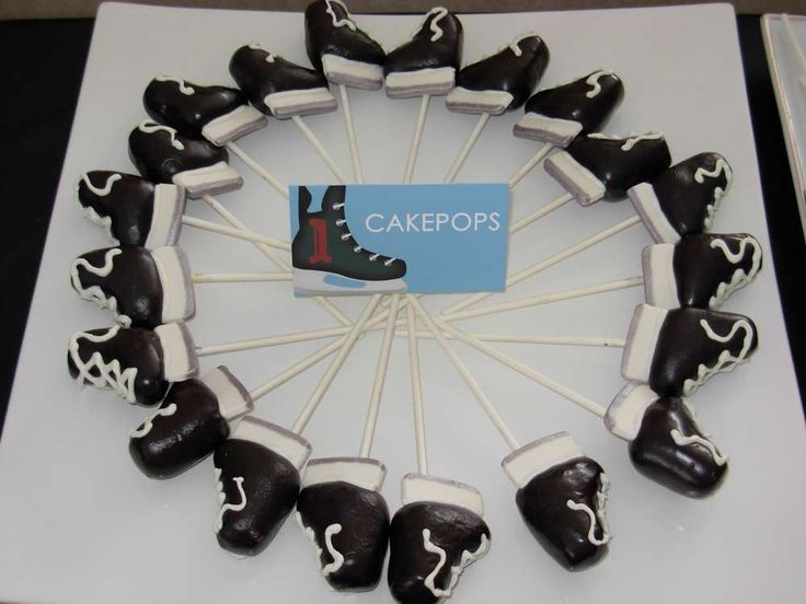 there is a cake with chocolate shoes on it