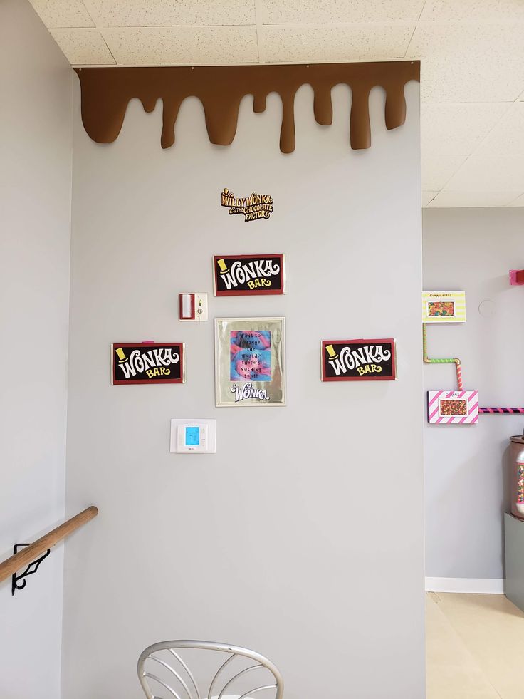 there are many candy bars hanging on the wall in this room, including one with icing