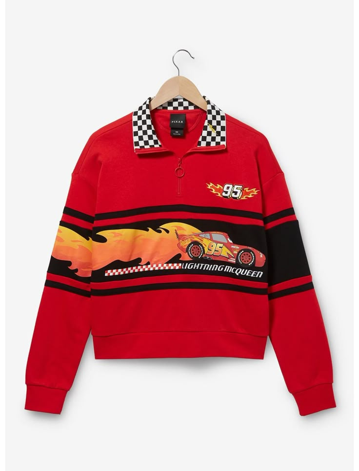 a red sweatshirt with an image of a car on the front and checkered sleeves