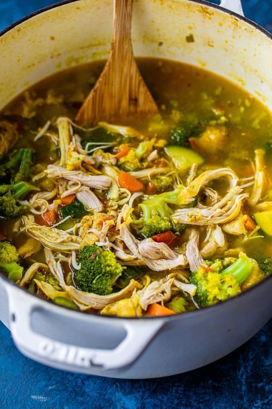 a pot filled with chicken and broccoli soup