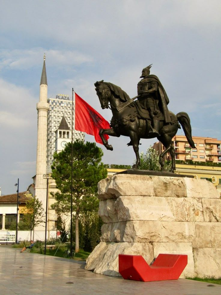 a statue of a man riding on the back of a horse