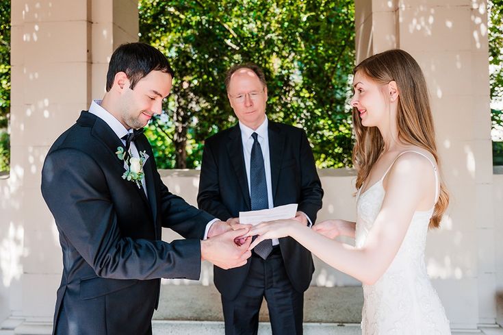 a bride and groom exchanging their wedding vows