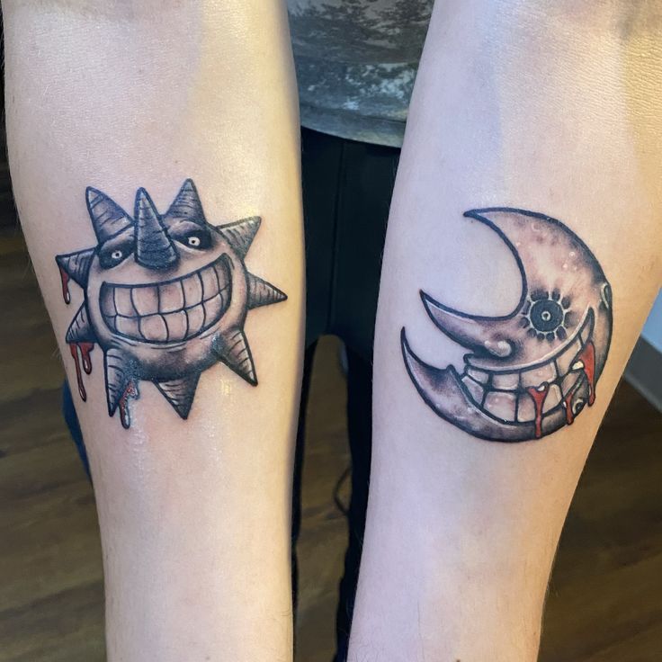 two people with tattoos on their legs that look like they are smiling at each other