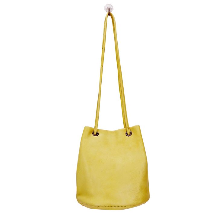 Incredibly versatile this compact drawstring bucket bag will be your on-the-go companion. Cassidy features bright, soft pebbled leather + pull through straps that can be worn double as shoulder straps or single as a crossbody. Details 100% Full-grain leather handcrafted by artisans in South America and India. Every hide is unique so you will notice natural variations in the grain texture and shading which are hallmarks of high-quality. 1/4" wide pull through strap. Wear it as a crossbody, 27", o Feeding America, Fashion Background, Bohemian Aesthetic, Drawstring Bucket Bag, Uptown Girl, Pull Through, Genuine Leather Bags, Leather Pulls, Boho Vibe