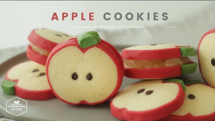 apple cookies are arranged on a plate to look like apples