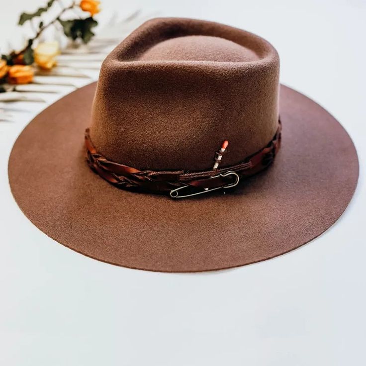 The Aspen Felt Fedora Hat is here to make a statement. This rancher-style hat is the perfect rustic piece to sport for your days in the great outdoors. Spice up any look with our unique braided leather matchstick band and wide smooth brim. #hats #fedorahats #felthats #ahm #americanhatmakers #wanderlustcollection Rustic Felt Hat With Flat Brim For Outdoor, Adjustable Hat Bands For Fall Outdoor Events, Adjustable Hat Bands For Outdoor Fall Activities, Rustic Flat Brim Felt Hat For Outdoor, Rustic Brimmed Felt Hat For Outdoor, Outdoor Fedora For Fall With Flat Crown, Rustic Outdoor Hat With Short Brim, Outdoor Fall Hat With Flat Crown, Outdoor Flat Crown Hats For Fall