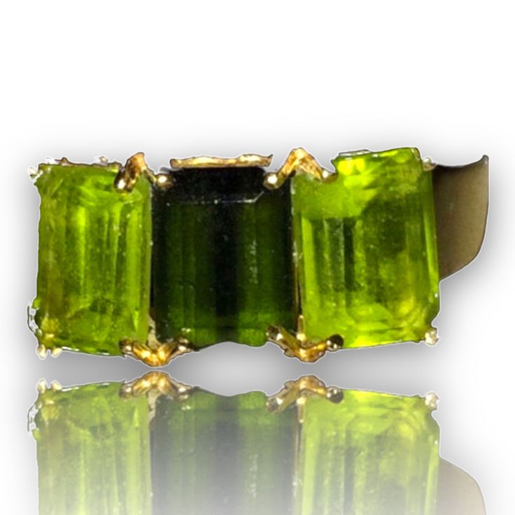 Beautiful Peridot 14K Yellow Gold Ring It is a size 6. Total weight of 3.3 grams solid 14K gold, stamped inside the ring. Features two rectangular peridot 12mm x 5mm and one rectangular dark green 12mm x 5mm center stone. I am unsure if it is an emerald? Or darker peridot. It is a beautiful ring and it will look beautiful on any one who wears it! Shipped insured/delivery confirmation I guarantee item to be exactly as described and pictured. Black Opal Pendant, Green Ring, Green Rings, Peridot Green, Black Gift Boxes, Cute Rings, Pinky Ring, Yellow Gold Ring, Multi Stone Ring