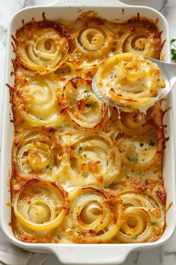 a casserole dish filled with pasta and cheese