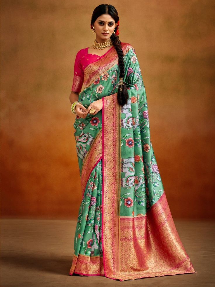 Enhance your ethnic wardrobe with our stunning green kalamkari printed banarasi silk saree! This exquisite saree is crafted from high-quality Banarasi silk material, known for its lustrous texture and elegant drape. The beautiful green color adds a touch of vibrancy and freshness, making it a perfect choice for weddings, festivals, and other special occasions.
Kalamkari is a traditional art form that involves hand-painting or block-printing intricate designs on fabric. The kalamkari prints on th Saree Floral, Indian Saree Blouse, Simple Sarees, Kalamkari Saree, Banarasi Silk Saree, Green Saree, Trendy Sarees, Latest Sarees, Tussar Silk Saree