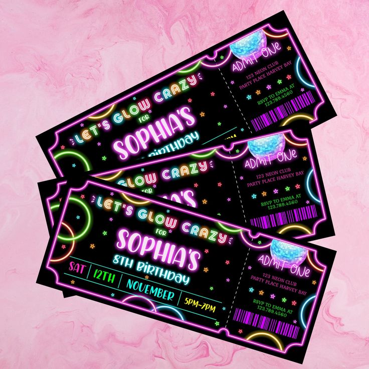 two tickets with neon lights on them